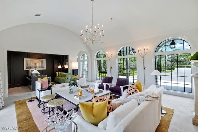 living room with brick ceiling, an inviting chandelier, and lofted ceiling