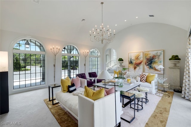 254 Audubon Blvd, Naples, FL 34110 - living room with arched walkways, an inviting chandelier, carpet, recessed lighting, and vaulted ceiling