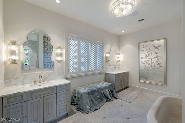254 Audubon Blvd, Naples, FL 34110 - full bathroom featuring a sink, visible vents, two vanities, and baseboards