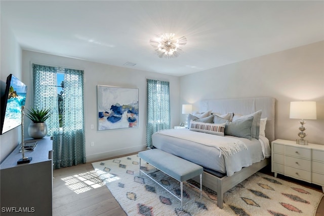 bedroom with light wood-type flooring