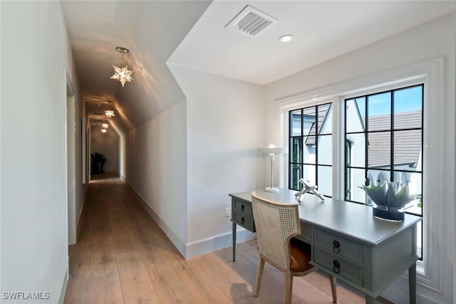 office space with light hardwood / wood-style floors