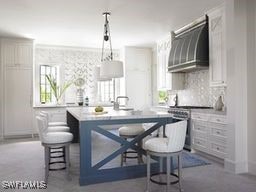 kitchen with white cabinets, a center island, decorative light fixtures, premium range hood, and a breakfast bar