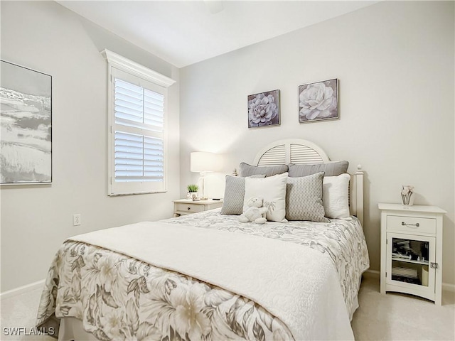 bedroom featuring light carpet