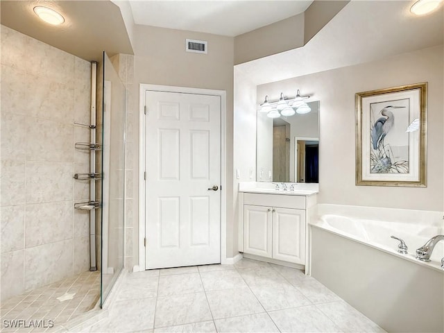 bathroom featuring tile patterned floors, vanity, and separate shower and tub