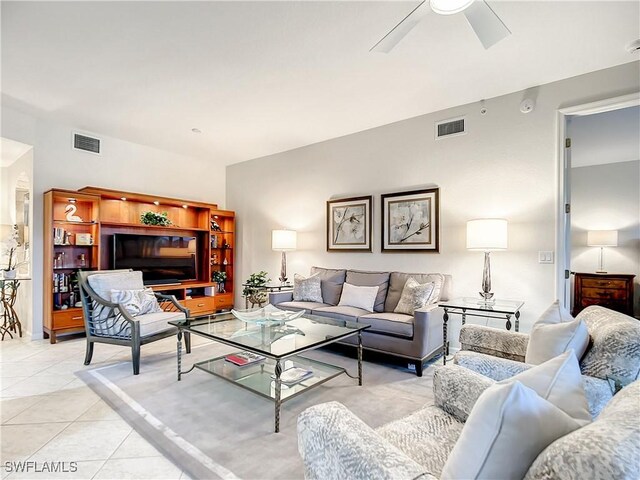 living room featuring ceiling fan and light tile patterned floors