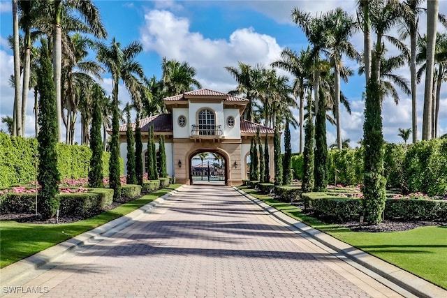 mediterranean / spanish-style home featuring a front lawn