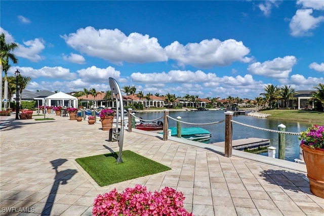 exterior space with a boat dock and a water view