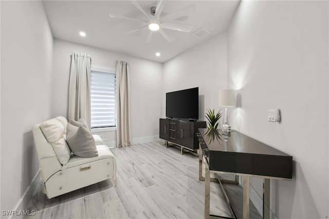 interior space with hardwood / wood-style flooring and ceiling fan