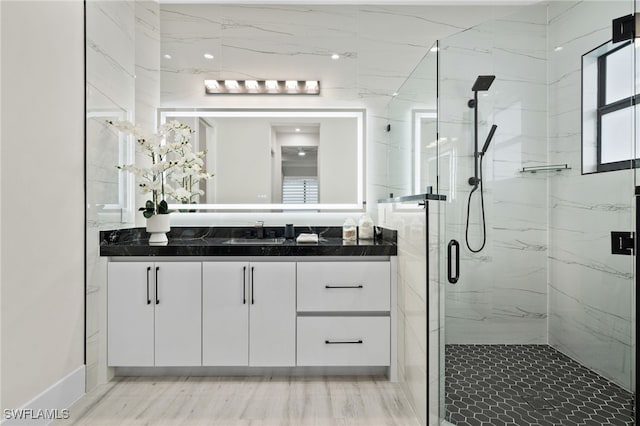 bathroom with vanity and walk in shower