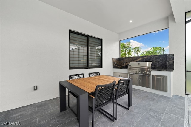 view of patio with area for grilling and an outdoor kitchen