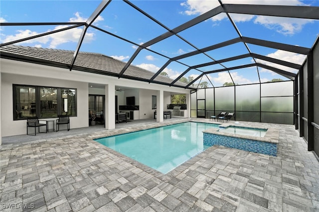 view of swimming pool featuring glass enclosure, ceiling fan, area for grilling, an in ground hot tub, and a patio