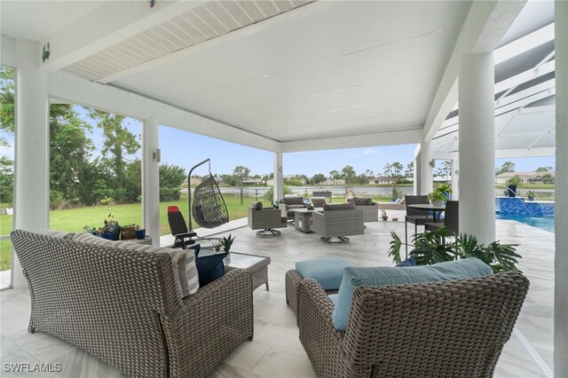 view of patio with an outdoor hangout area and pool water feature