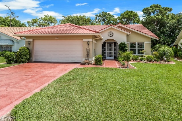 mediterranean / spanish-style home featuring a garage and a front lawn