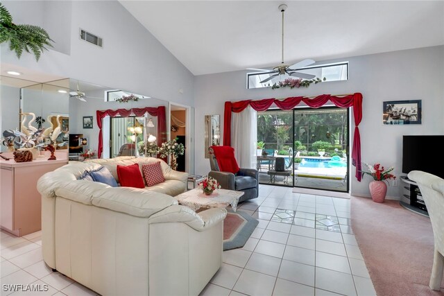 living room featuring ceiling fan, light tile patterned floors, and high vaulted ceiling