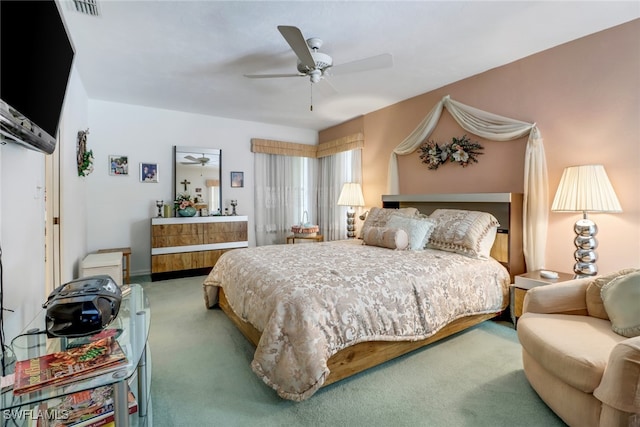 bedroom with ceiling fan and carpet flooring