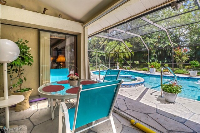 view of pool featuring a lanai and a patio area