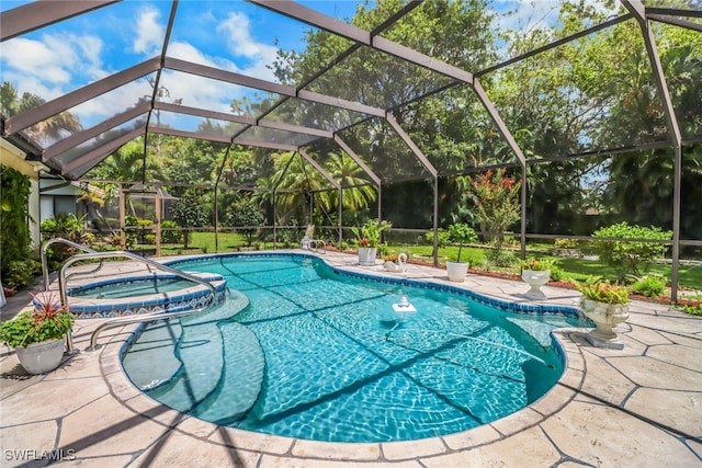 view of swimming pool with a lanai, an in ground hot tub, and a patio area