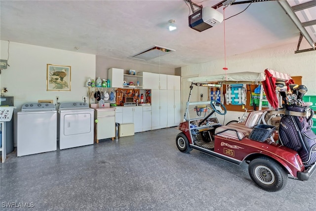 garage featuring separate washer and dryer and a garage door opener