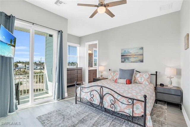 bedroom featuring access to exterior, connected bathroom, light hardwood / wood-style floors, and ceiling fan