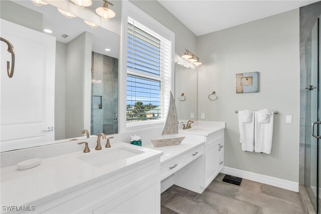 bathroom featuring vanity and a shower with door