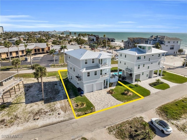 bird's eye view with a water view and a residential view