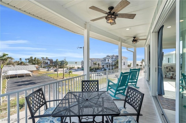 balcony featuring a ceiling fan and outdoor dining space