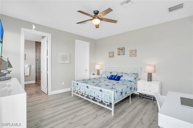 bedroom with connected bathroom, light hardwood / wood-style floors, and ceiling fan