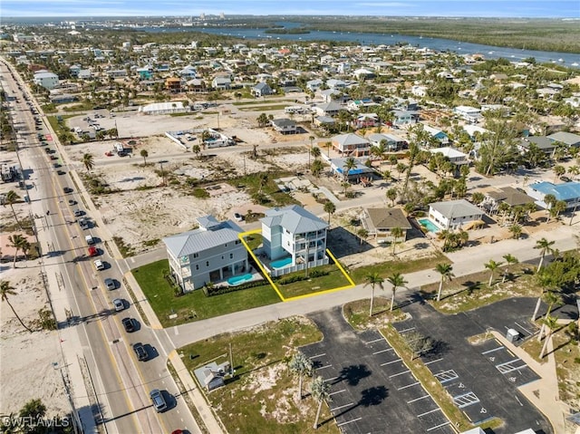 aerial view with a water view and a residential view