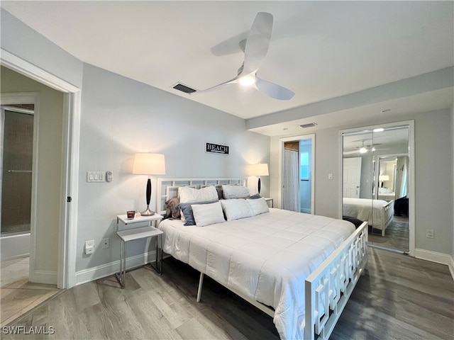 bedroom with ceiling fan and hardwood / wood-style flooring