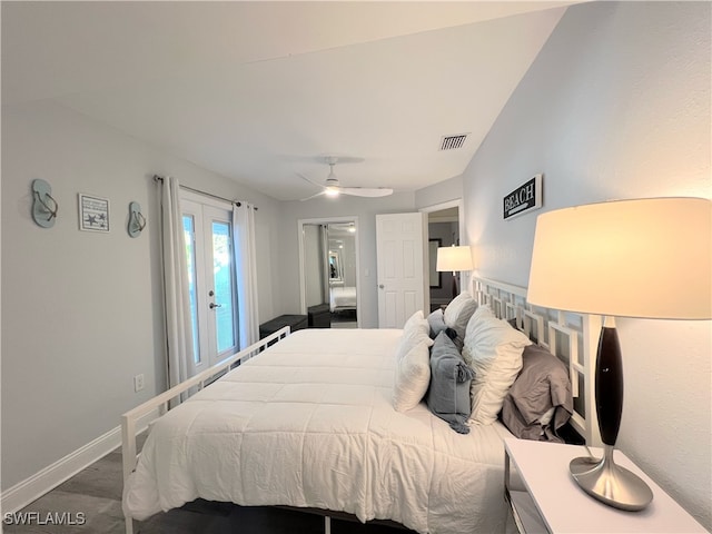 bedroom with french doors, ceiling fan, and dark hardwood / wood-style floors