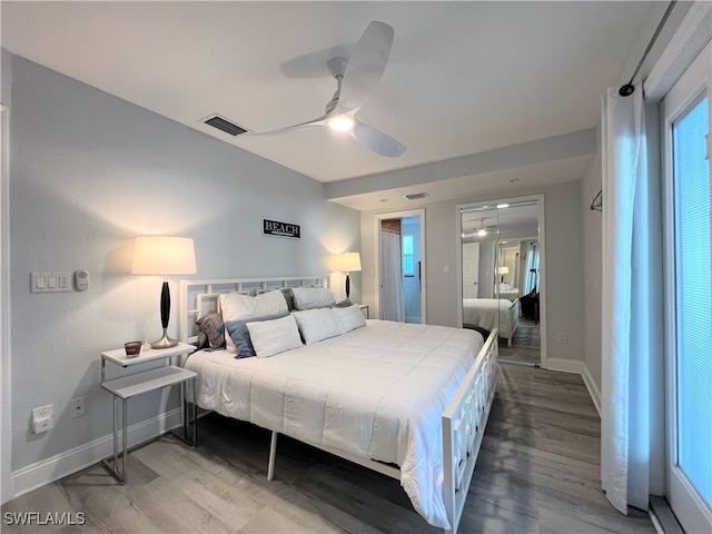 bedroom featuring wood-type flooring and ceiling fan