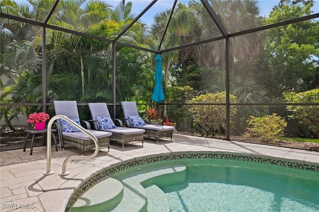 view of pool featuring a lanai and a patio area