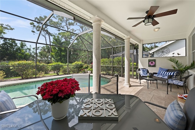 view of swimming pool featuring an outdoor hangout area, a patio area, ceiling fan, and a lanai