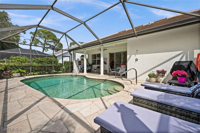 pool with ceiling fan and a patio