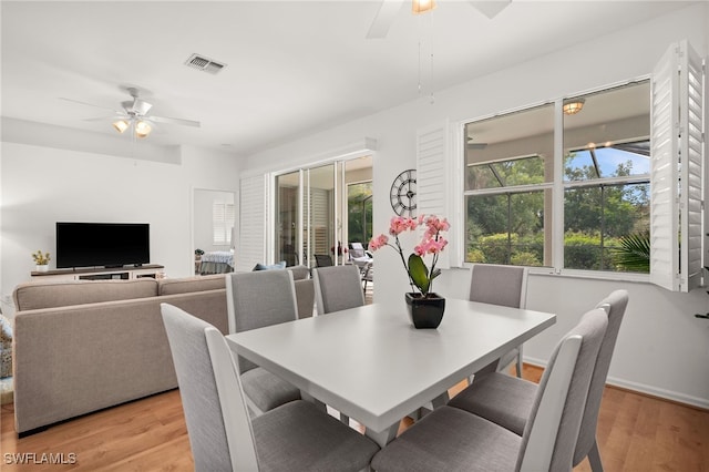 dining space featuring ceiling fan and light hardwood / wood-style flooring