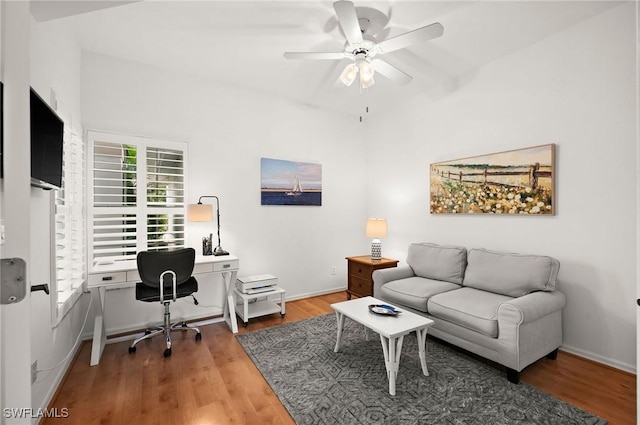 office area featuring wood finished floors, a ceiling fan, and baseboards