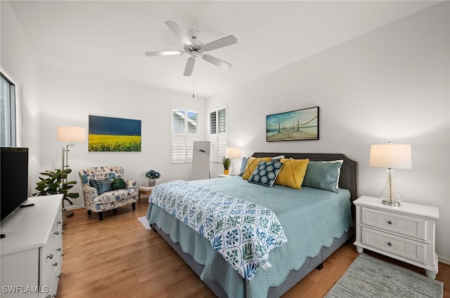 bedroom with light hardwood / wood-style floors and ceiling fan