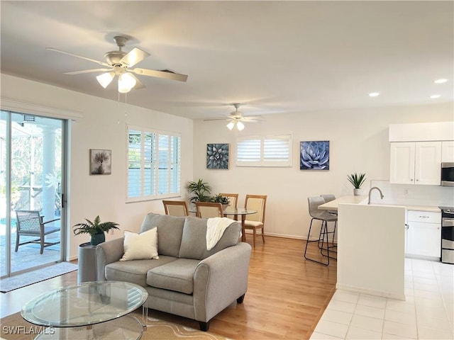25040 Bay Cedar Dr, Bonita Springs, FL 34134 - living area featuring recessed lighting, light wood finished floors, baseboards, and a ceiling fan