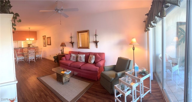 living room featuring dark hardwood / wood-style floors and ceiling fan