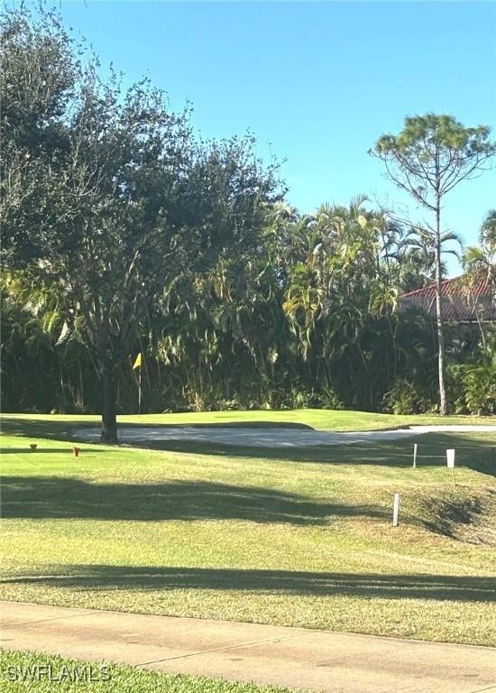 view of home's community featuring a lawn