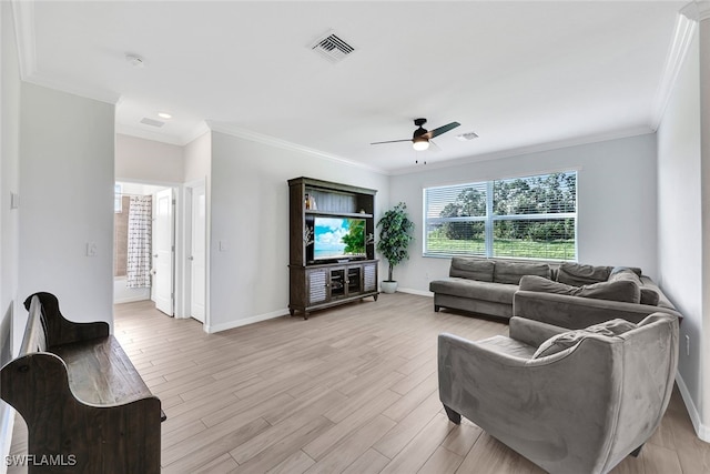 living room with ceiling fan, ornamental molding, and light hardwood / wood-style flooring