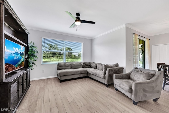 living room with ornamental molding, light hardwood / wood-style flooring, and ceiling fan