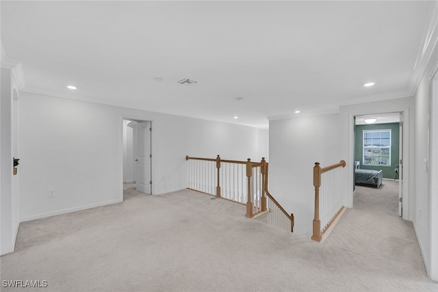 unfurnished room with light colored carpet and ornamental molding