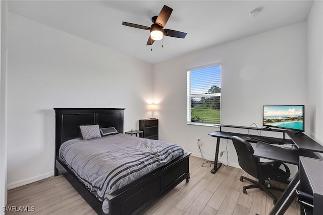 bedroom featuring ceiling fan and light hardwood / wood-style flooring