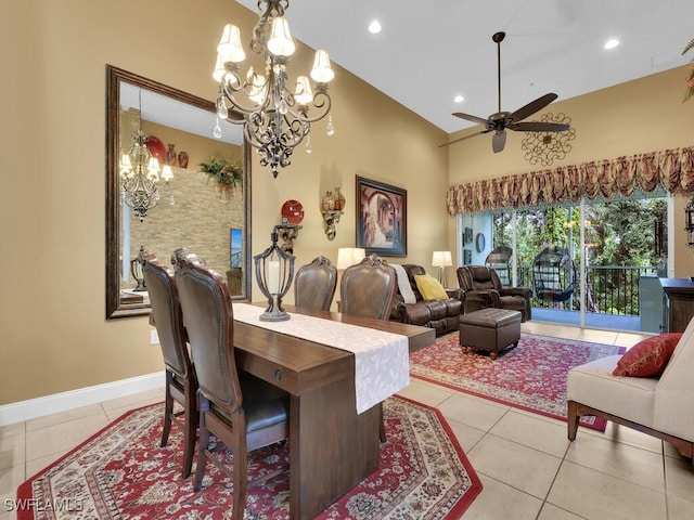 dining room with ceiling fan with notable chandelier, light tile patterned floors, and high vaulted ceiling