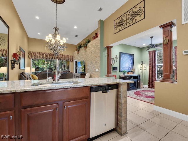 kitchen with sink, ceiling fan with notable chandelier, light tile patterned floors, ornate columns, and dishwasher