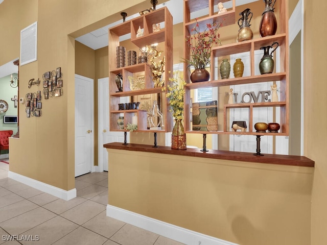 bar featuring tile patterned flooring