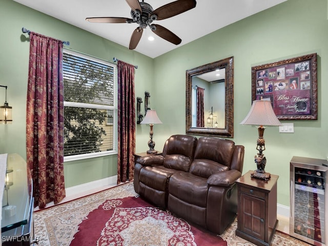 living room featuring ceiling fan and beverage cooler