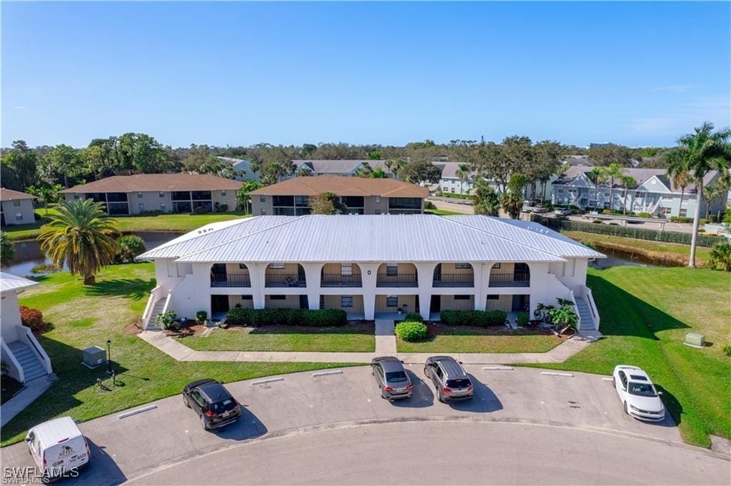 birds eye view of property with a residential view