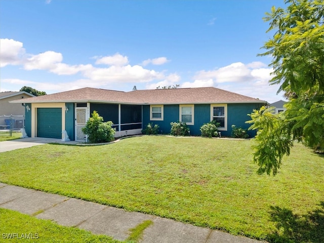 ranch-style house with a garage, a sunroom, and a front lawn